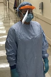 A doctor in full PPE.