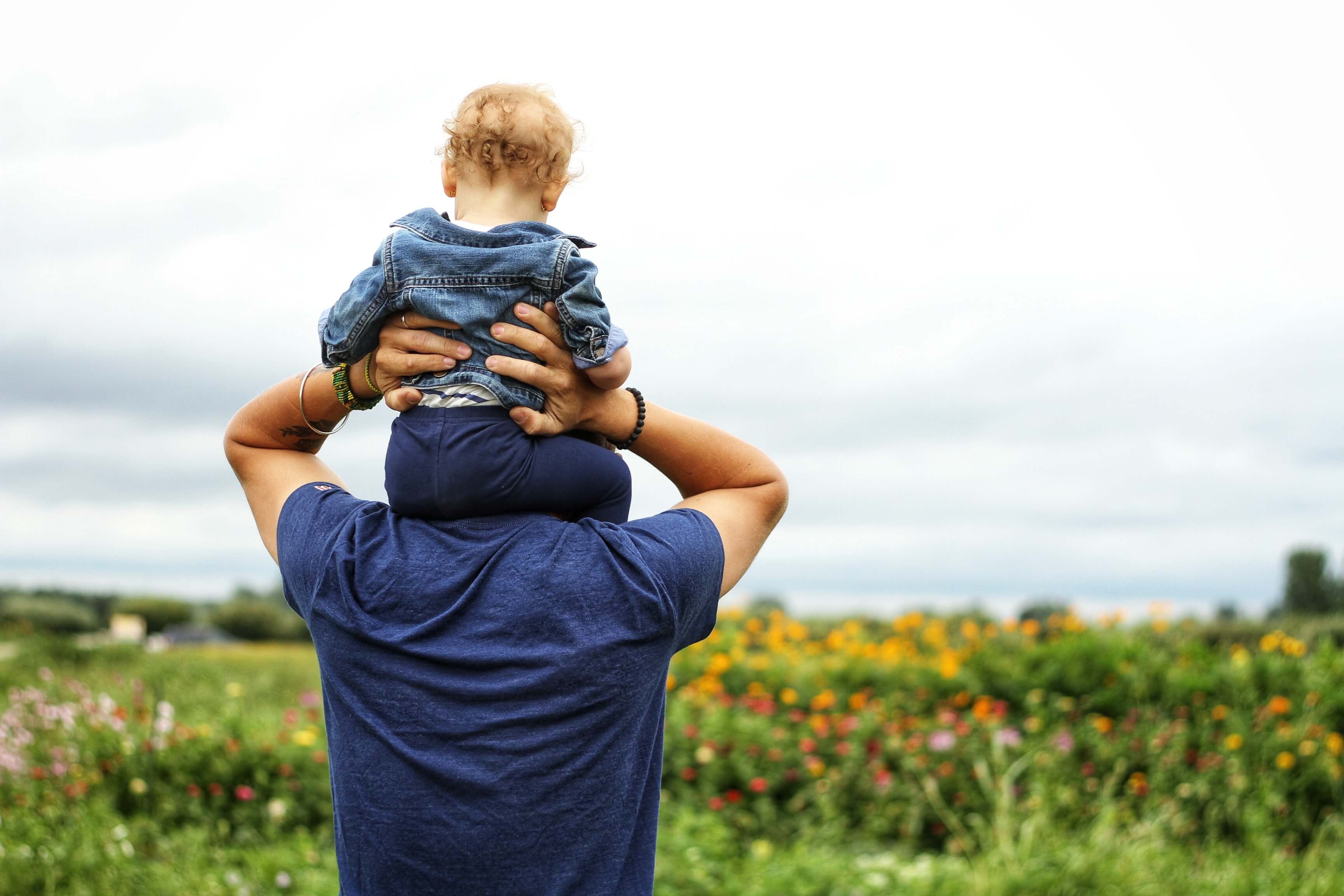 Man and son in a meadow. It's important to support child abuse prevention awareness.