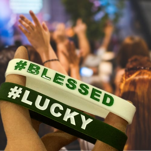 White and Black Rubber Bracelets with #BLESSED and #LUCKY ink injected text in green and white respectively