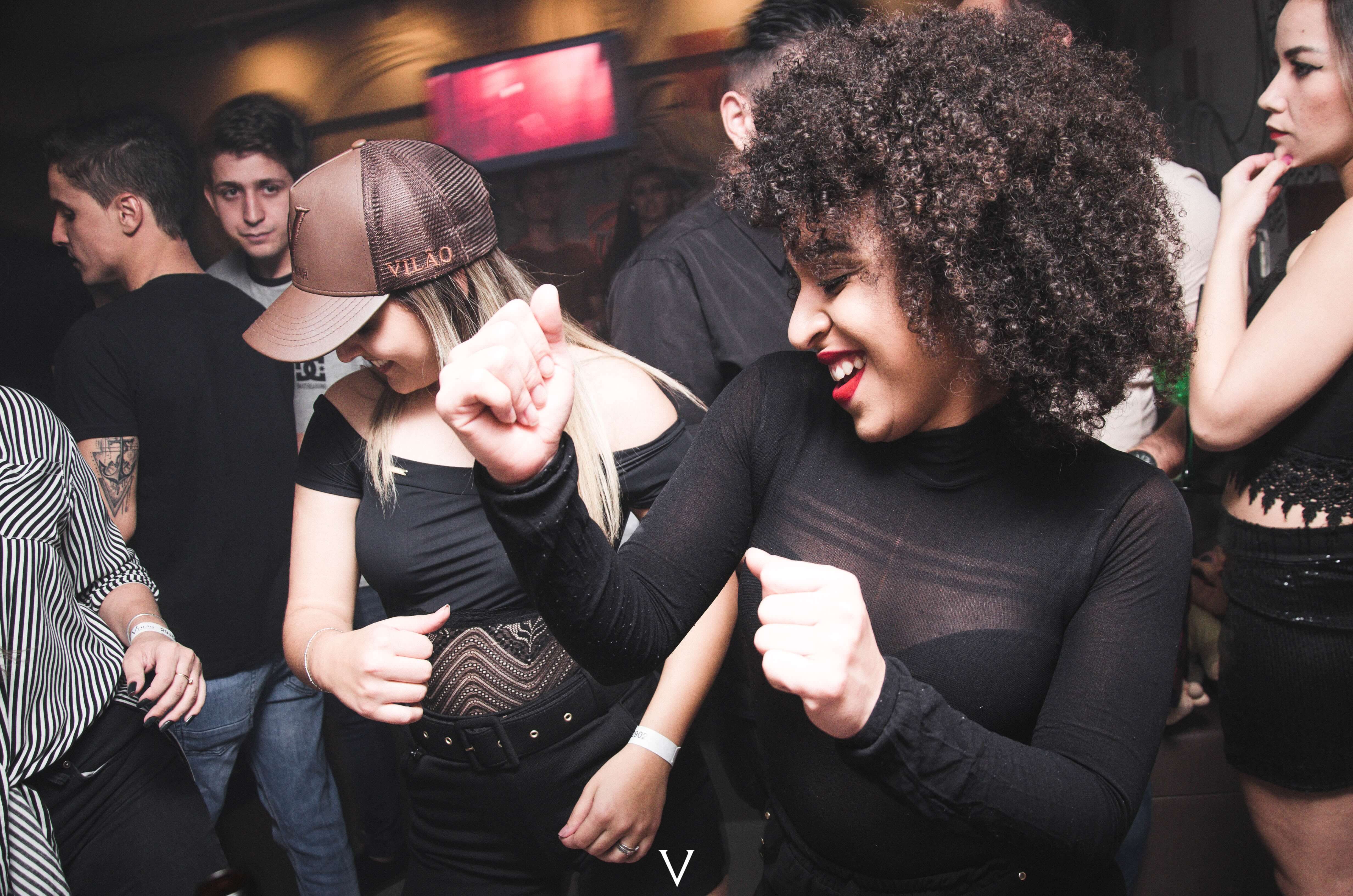 dancing at a club wearing tyvek wristbands.