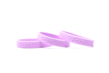 Purple embossed wristbands that says faith.