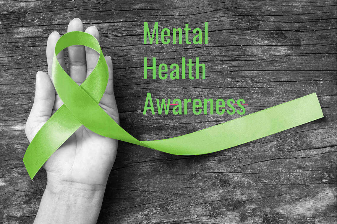 Green ribbon represents mental health awareness.