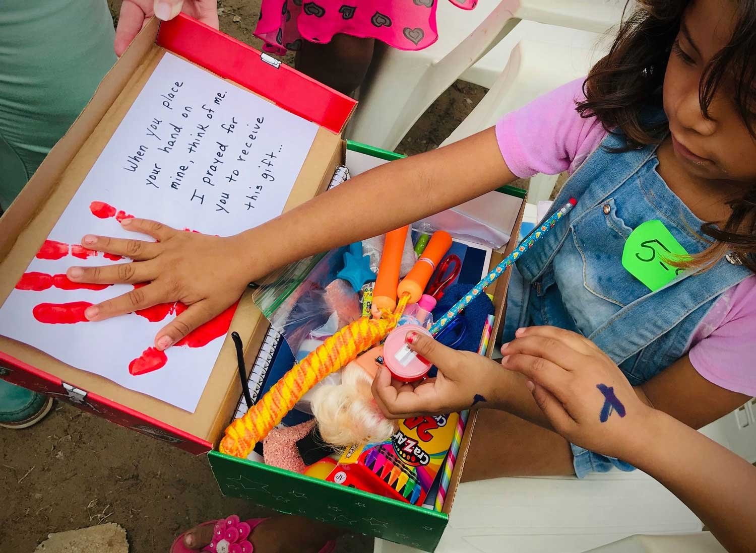 Handprint and Handwritten Note Inside Shoebox