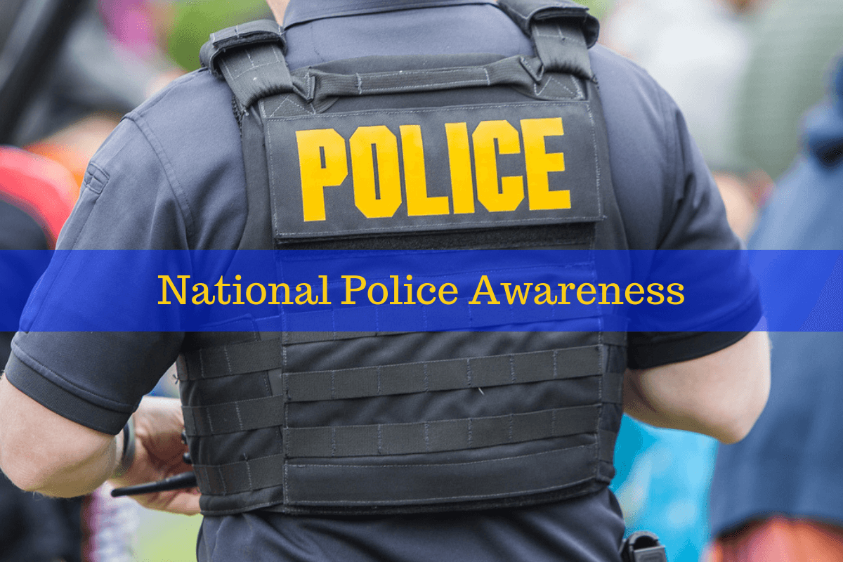 A police officer standing. Celebrate national police awareness by purchasing a wristband.