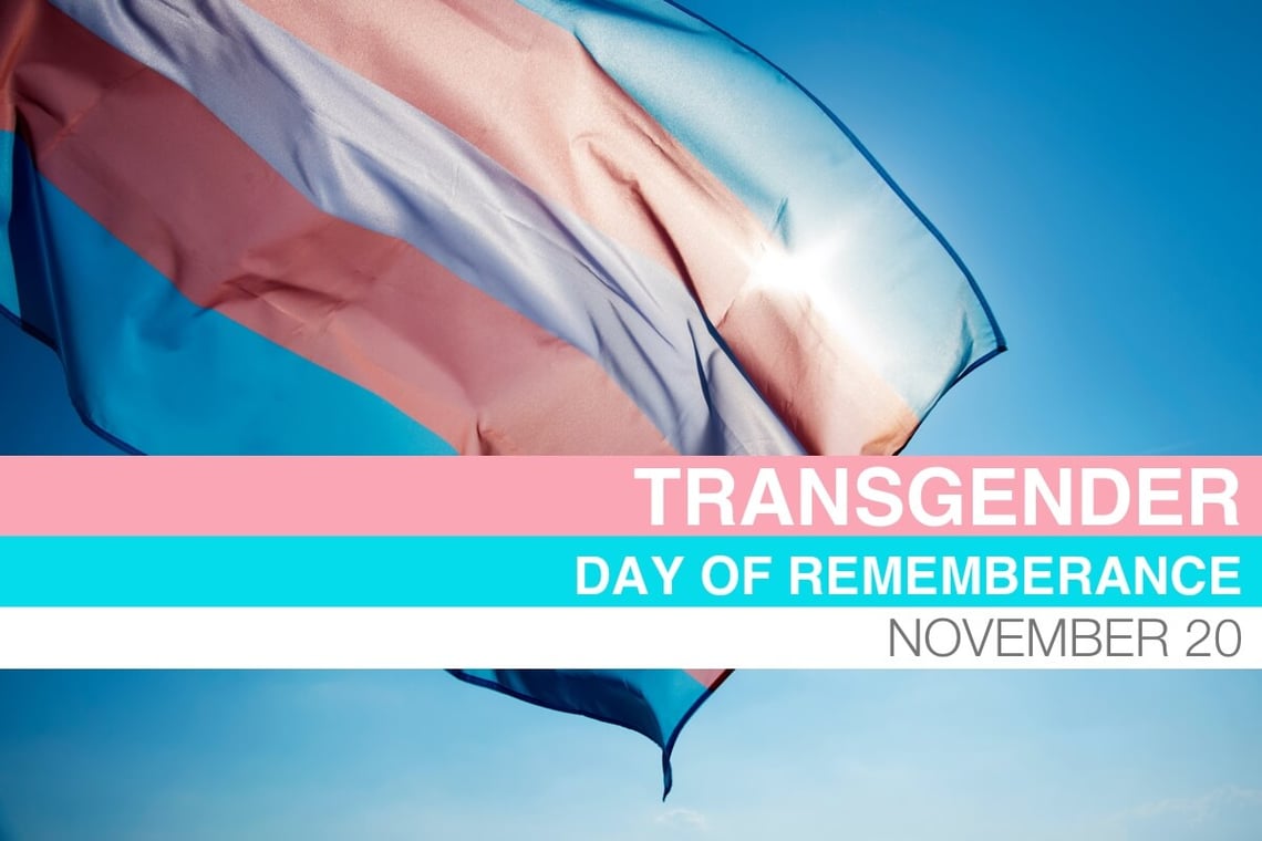 The pink, blue, and white flag represents Transgender Day of Remembrance.