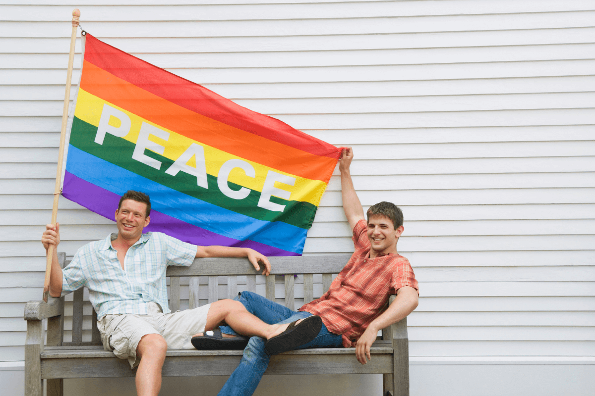 two-men-holding-a-gay-pride-flag