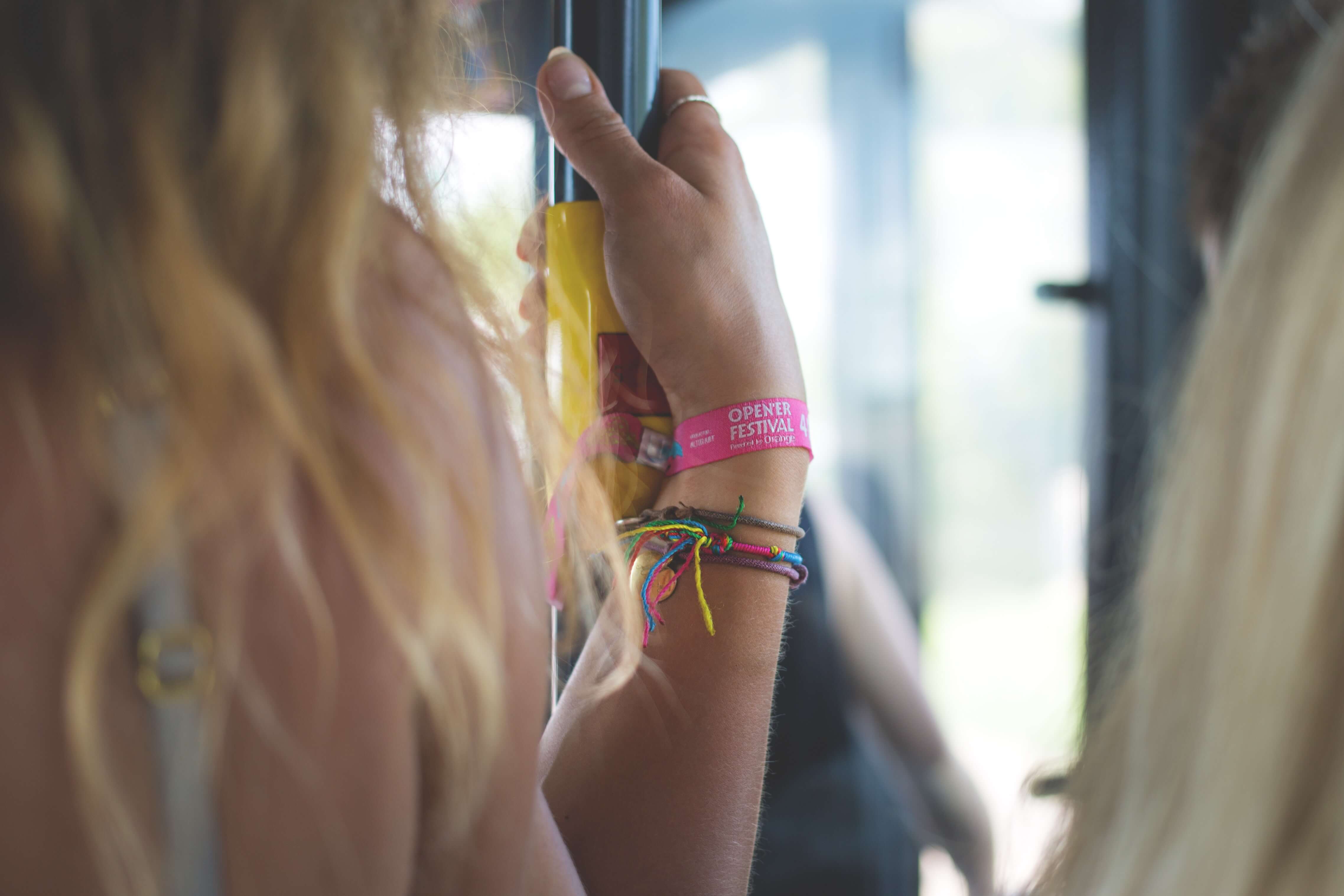 An individual wearing an event wristband.