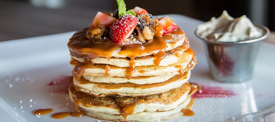 Delicious pancakes with fruit on top