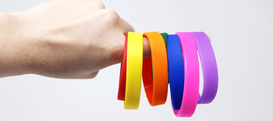 Multiple silicone wristbands in various bright colors